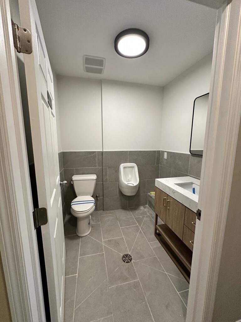 Commercial Bathroom — Full Tile & Fixtures — completed by FirstLine Build Group in Wappingers Falls, NY